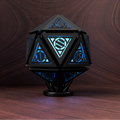 Geometric lamp with blue light on a wooden surface and background